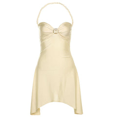 Beige strapless dress with a decorative neckline on a white background