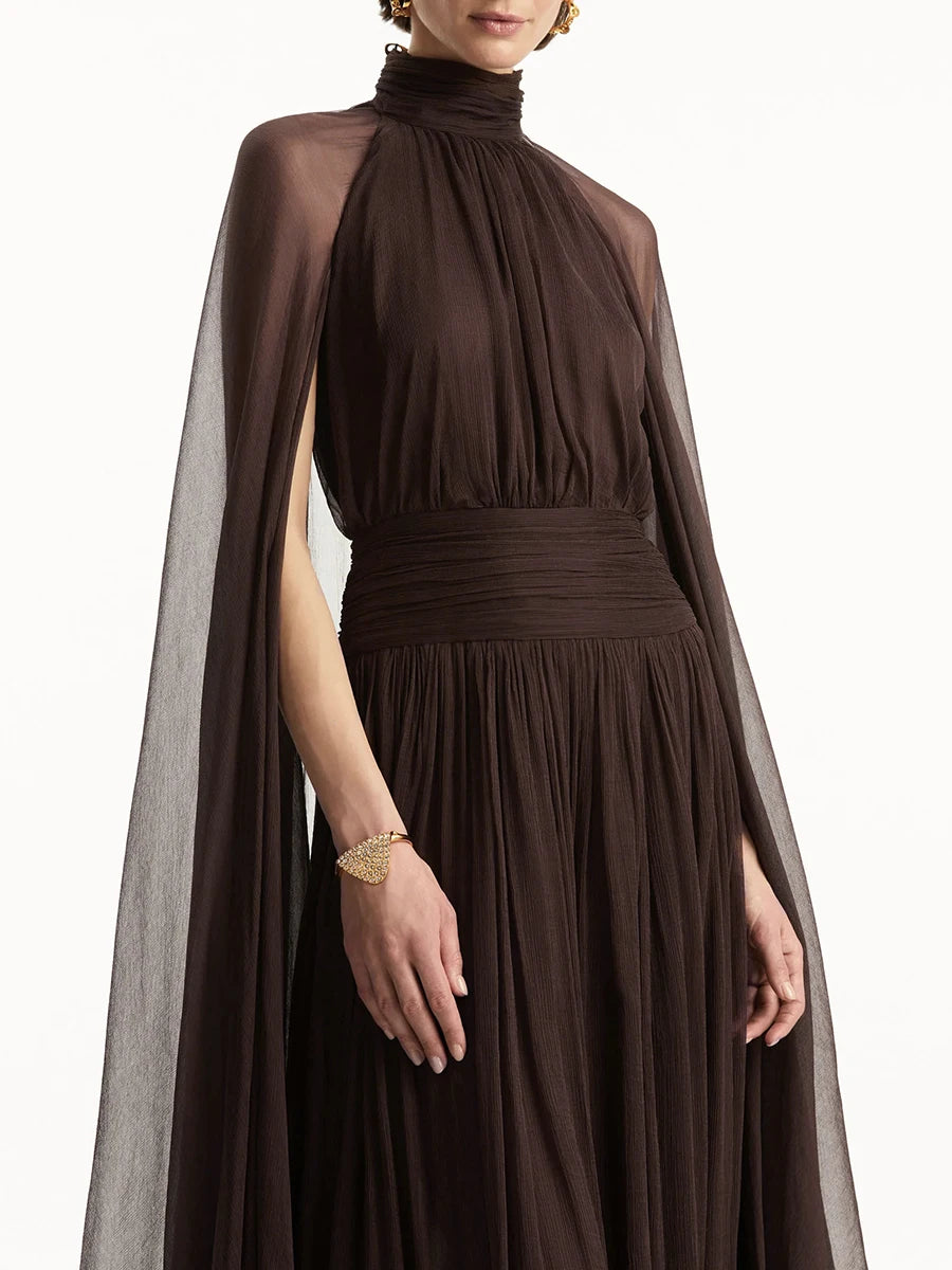 Brown dress with cape on a white background
