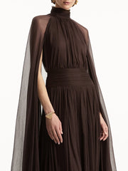 Brown dress with cape on a white background