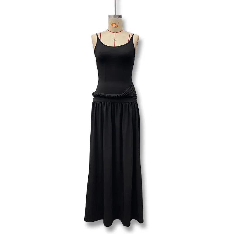 Black dress on a mannequin against a white background