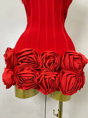 Red corset dress with floral details on a mannequin against a white background