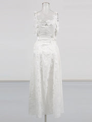 White lace dress on a mannequin against a white background