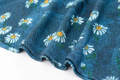 Detail of the daisy print fabric on a maxi dress
