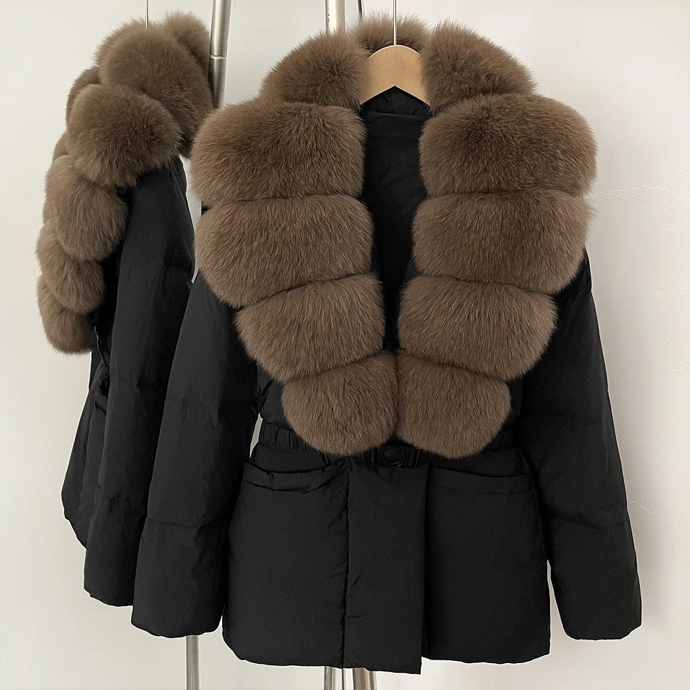 Black coat with brown fur collar on a mannequin against a white background