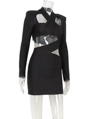 Black dress with sheer panels on a mannequin against a white background