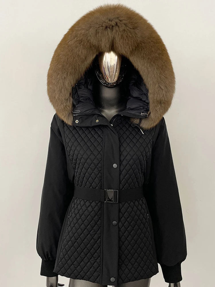 Black quilted jacket with a fur-lined hood on a mannequin against a white background