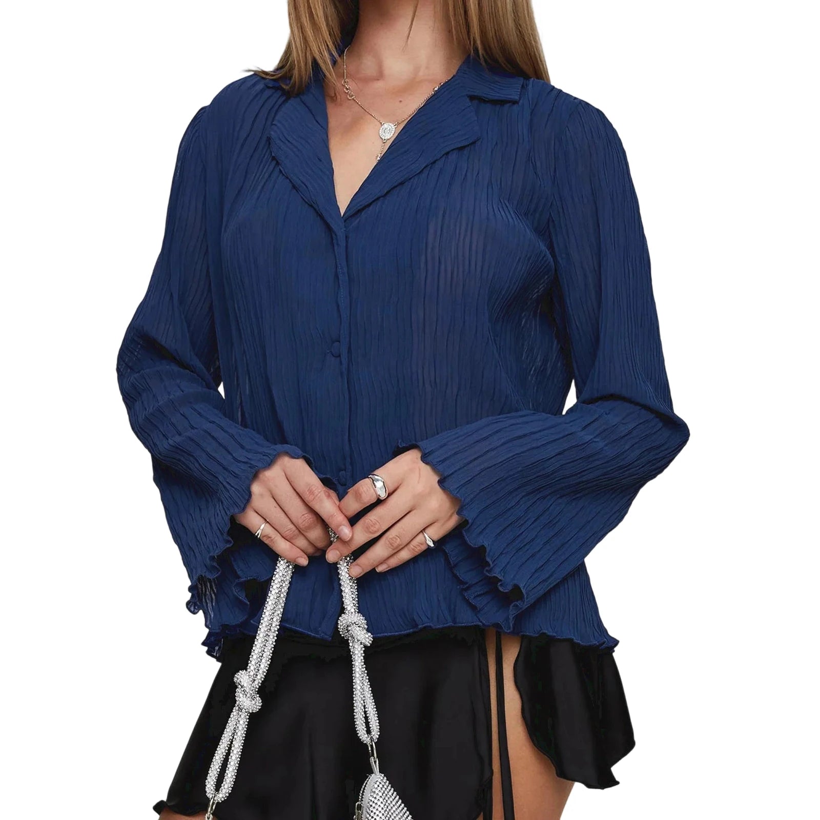 Woman wearing a blue pleated blouse with a white background