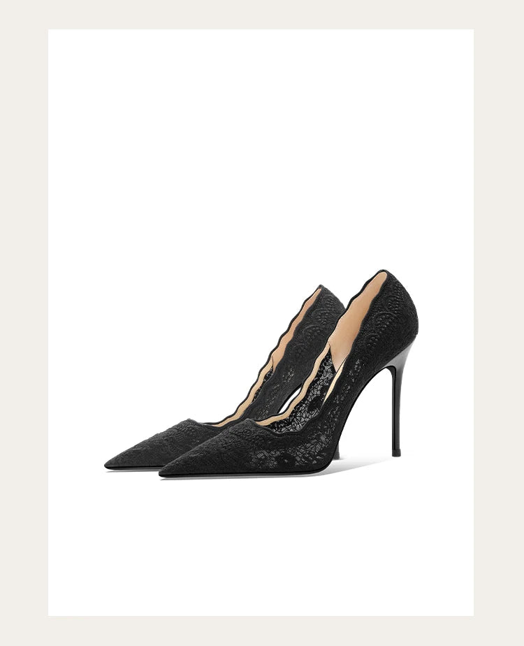 Black high-heeled shoes with a subtle pattern on a white background