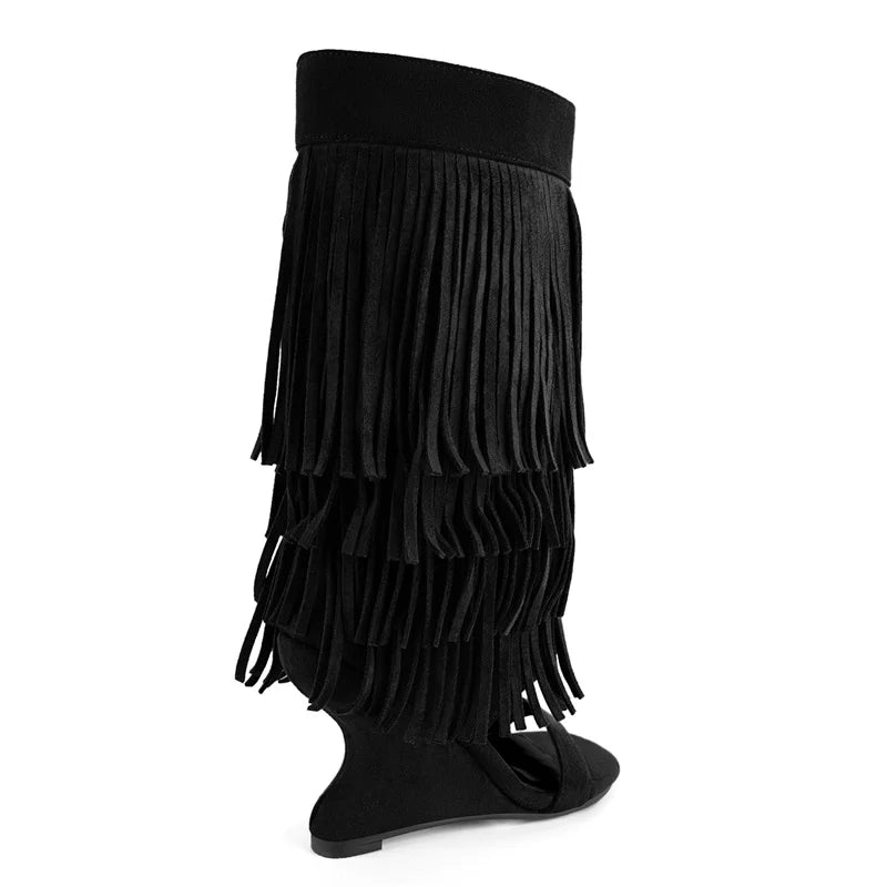 Side view of black fringe wedge heel boots
