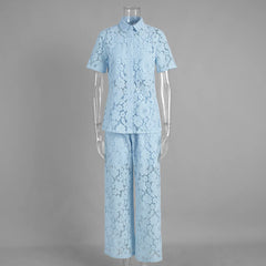 Light blue lace outfit on a mannequin against a gray background