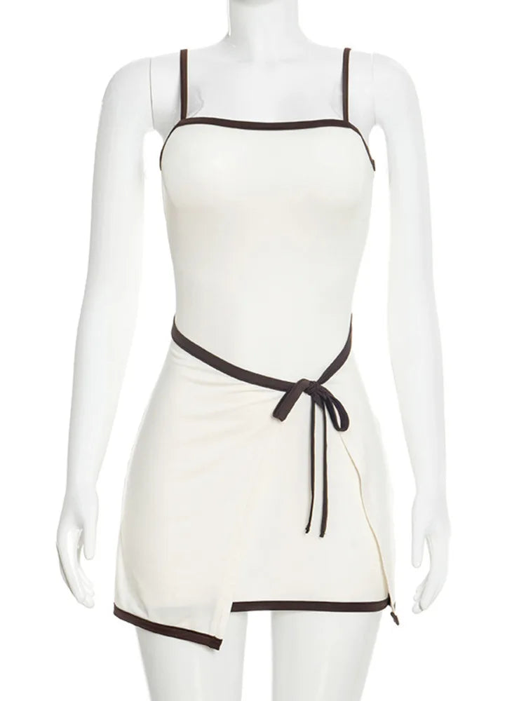White apron with brown trim on a mannequin against a white background