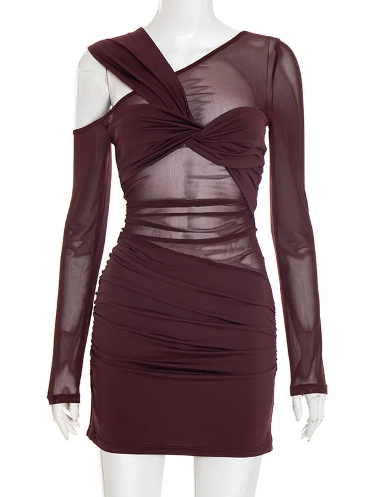Maroon dress with sheer overlay on a mannequin against a white background