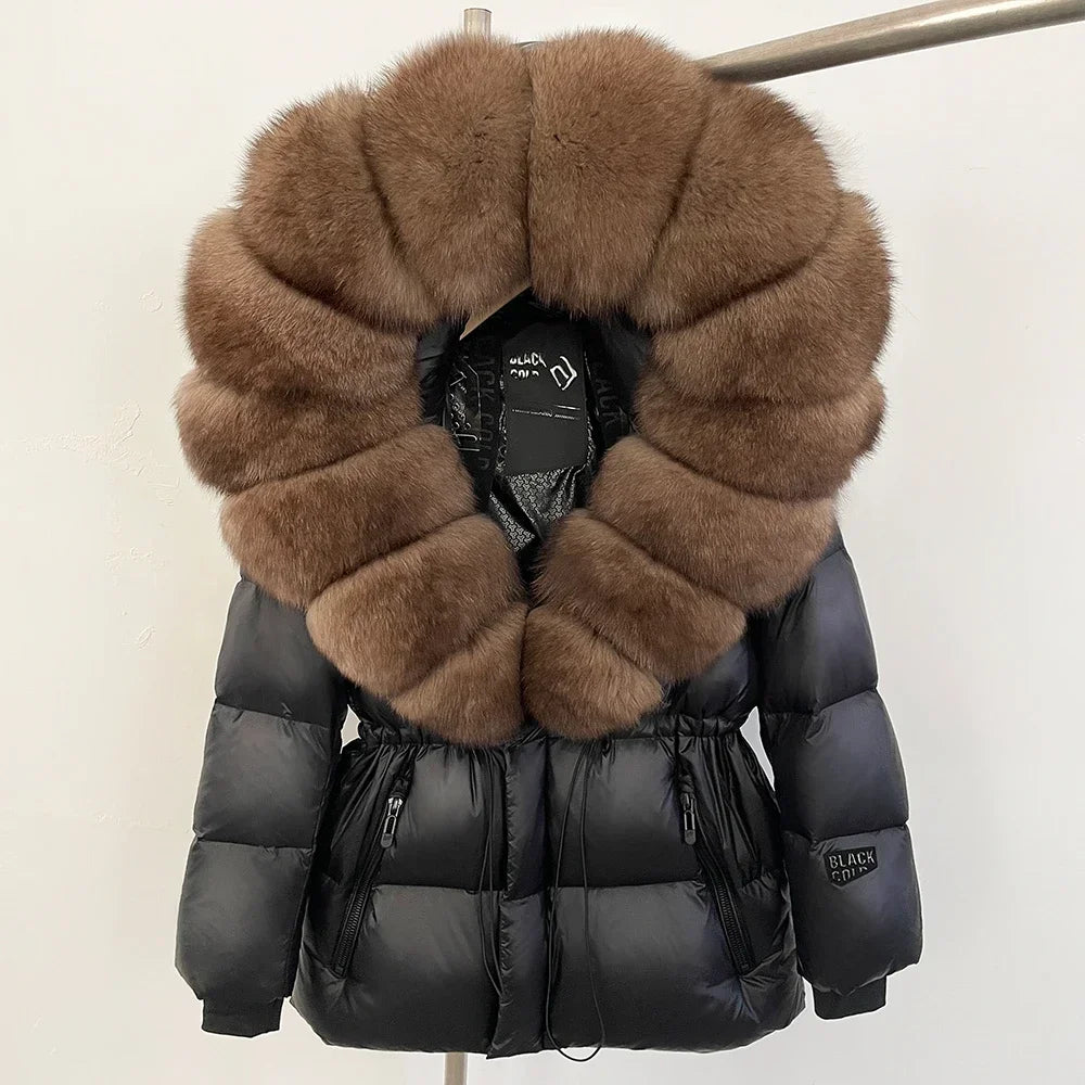 Black puffer jacket with brown fur collar on a mannequin against a white background