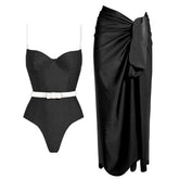 Black one-piece swimsuit with white belt and black wrap skirt