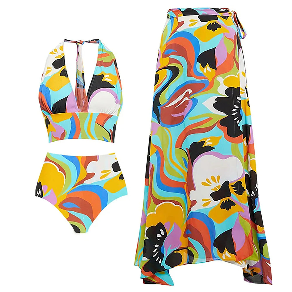 Vibrant abstract print two-piece halter top, bikini bottom, and maxi skirt laid flat