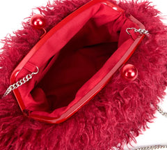 Red fluffy handbag with a chain strap on a white background