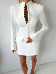 White blazer and skirt set on a plain background