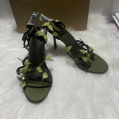 Side view of green leaf embellished stiletto heels