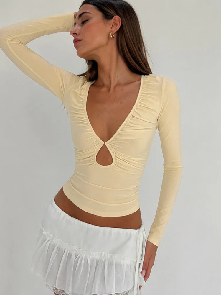 Light yellow ruched cutout v-neck long sleeve top detail