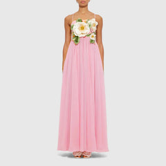 Pink dress with floral embellishments on a white background