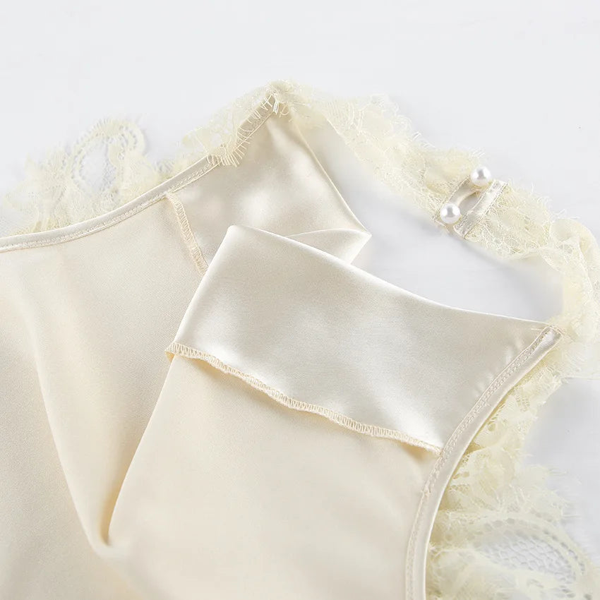 Cream-colored lace-trimmed lingerie on a light background