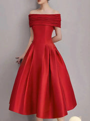 Red off-shoulder dress on a plain background