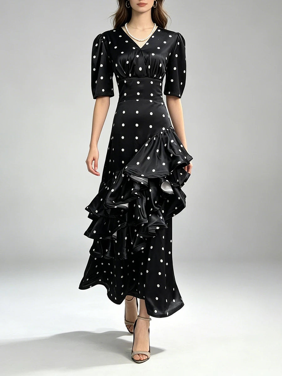 Model wearing a v-neck tiered ruffle polka dot maxi dress