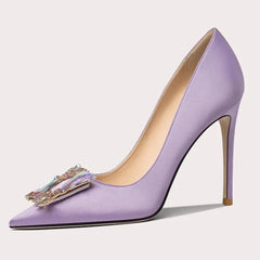 Purple high-heeled shoe with decorative bow on a light gray background