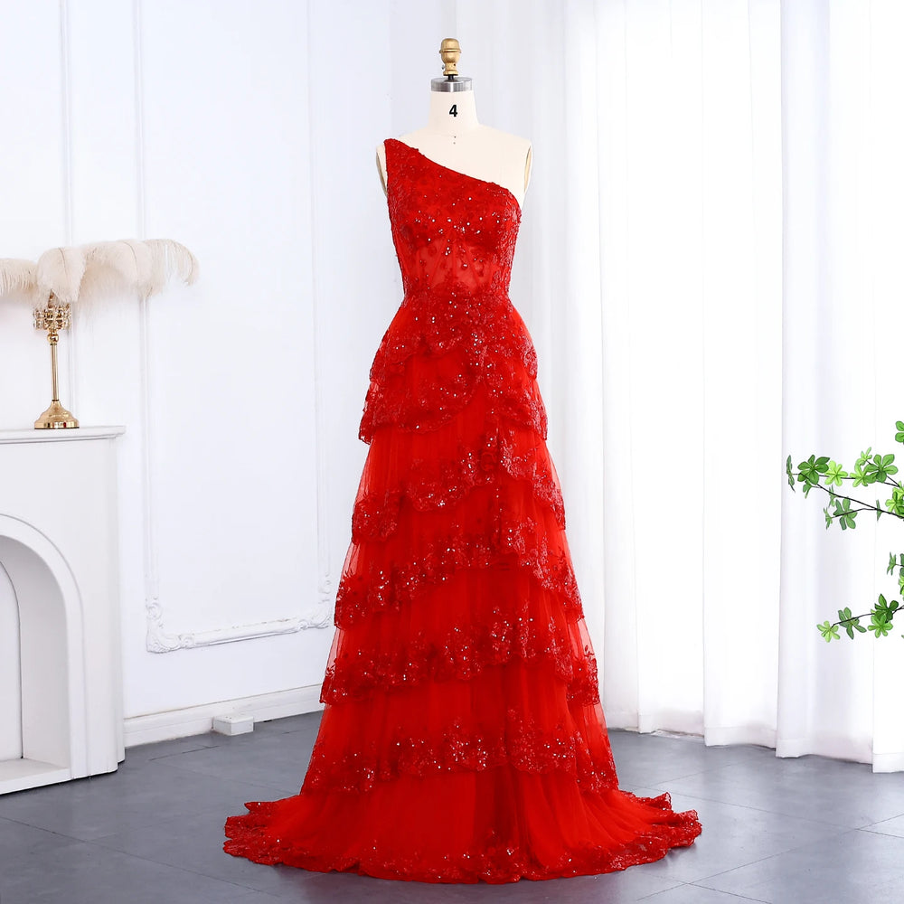 Red evening gown on a mannequin against a white curtain background