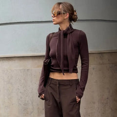 Brown knit top with scarf neck detail side view