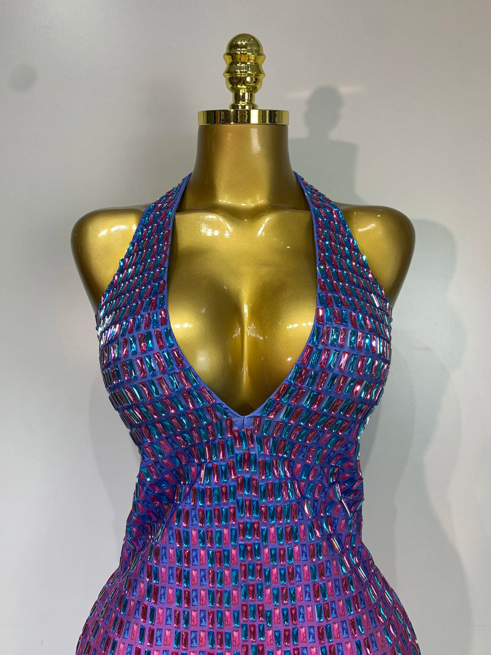 Close-up of halter neckline on crystal embellished bodycon mini dress