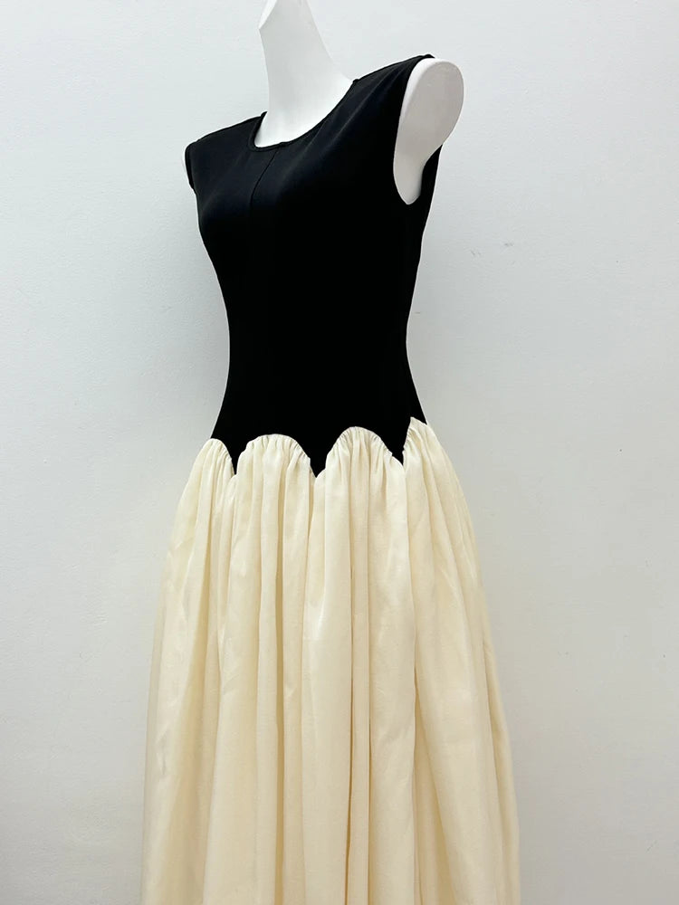 Mannequin wearing a black bodice and cream skirt against a white background
