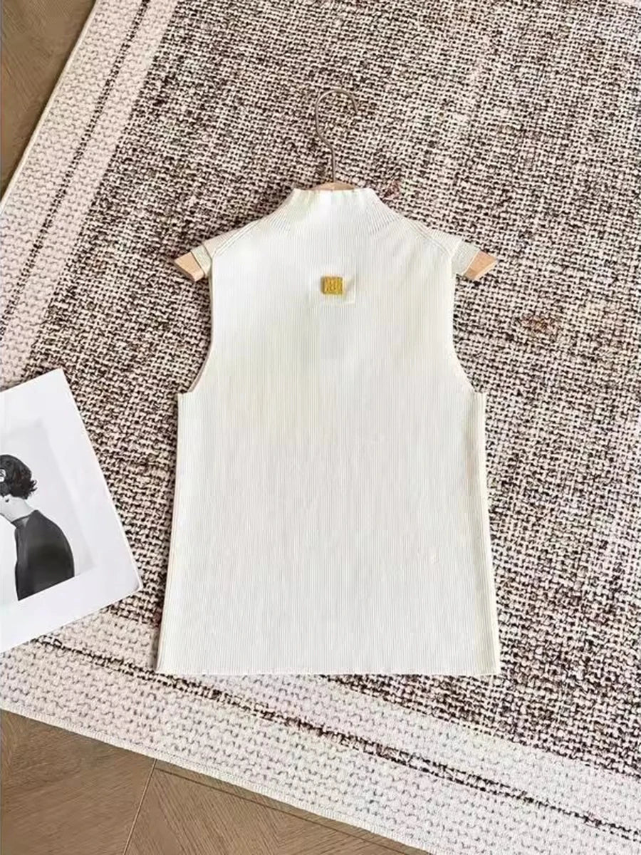 White dress on a hanger with a small tag on a textured surface