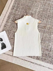 White dress on a hanger with a small tag on a textured surface