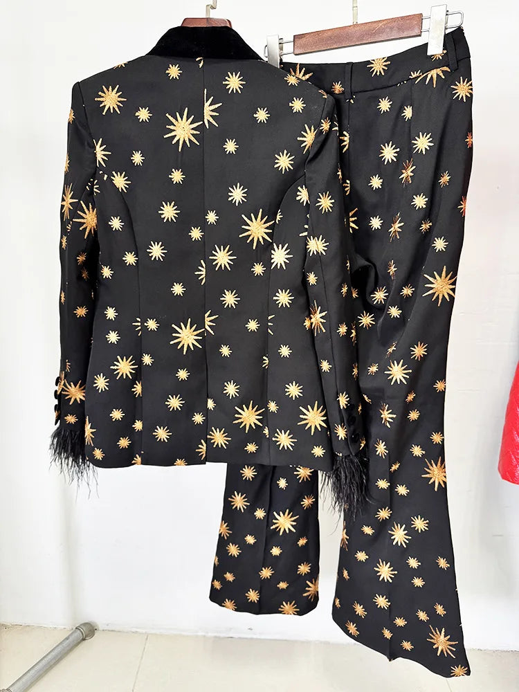 Back view of a black star embroidered blazer and flare pants set.