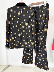 Back view of a black star embroidered blazer and flare pants set.