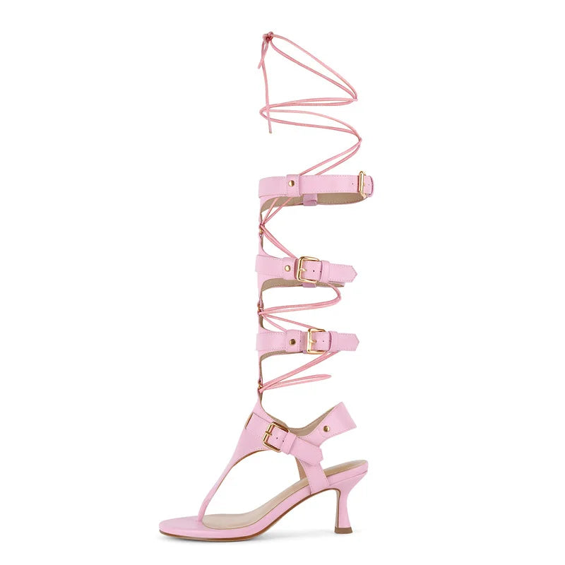 Side view of a pink lace-up gladiator kitten heel sandal