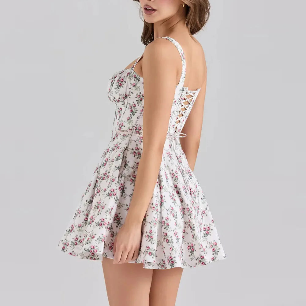 White floral dress with cut-out back on a gray background
