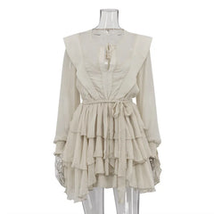 Beige dress on a mannequin against a white background