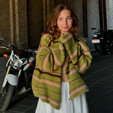 Green striped knit cardigan on a woman