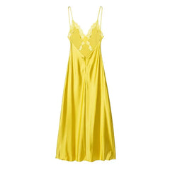 Yellow satin slip dress on a white background