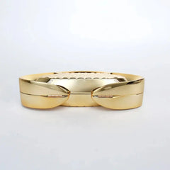 Gold ring with a textured band on a light gray background