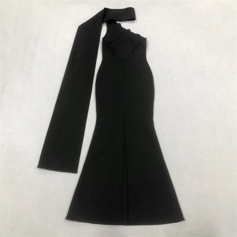 Black one-shoulder dress with a bow detail on a white background