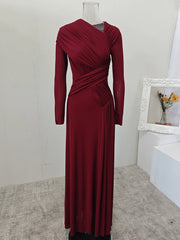 Maroon evening gown on a mannequin against a neutral background