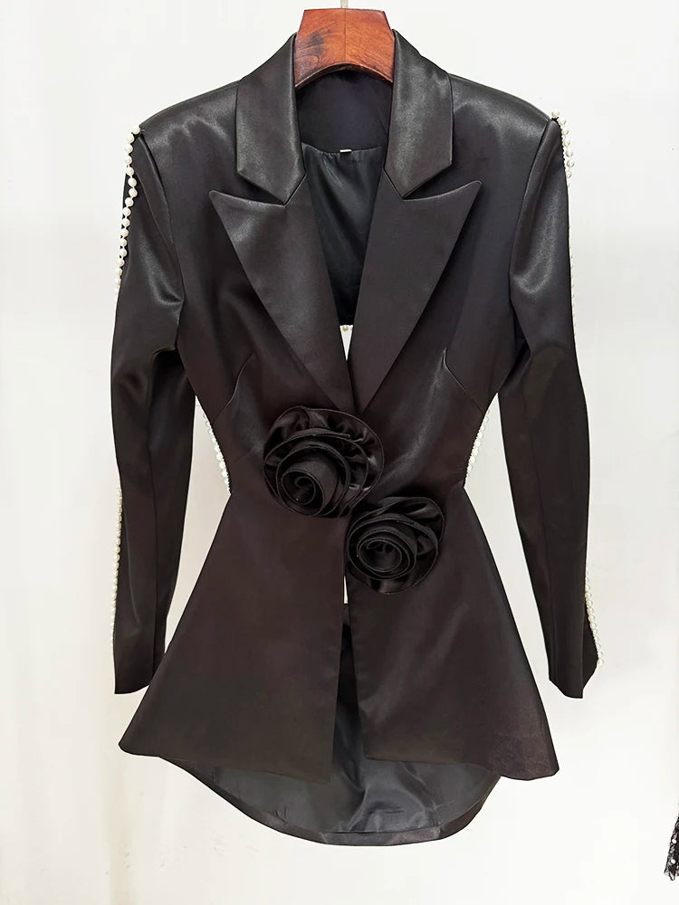 Close-up of black pearl embellished cutout blazer
