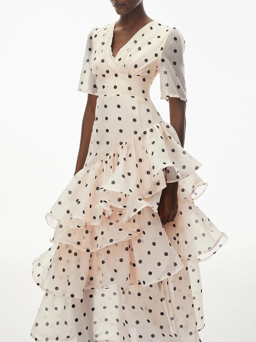 Close-up of the tiered ruffle detail on a polka dot maxi dress