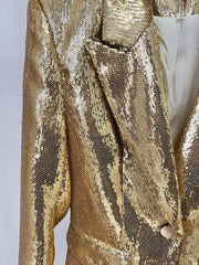 Gold sequin jacket on a plain background