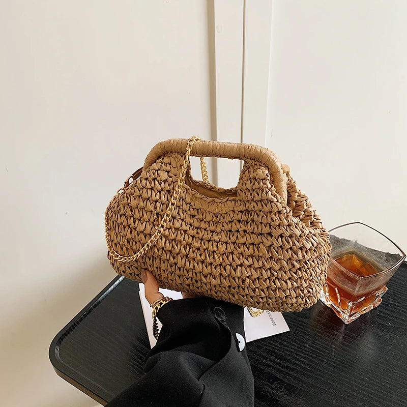 Woven handbag on a table with a glass of tea