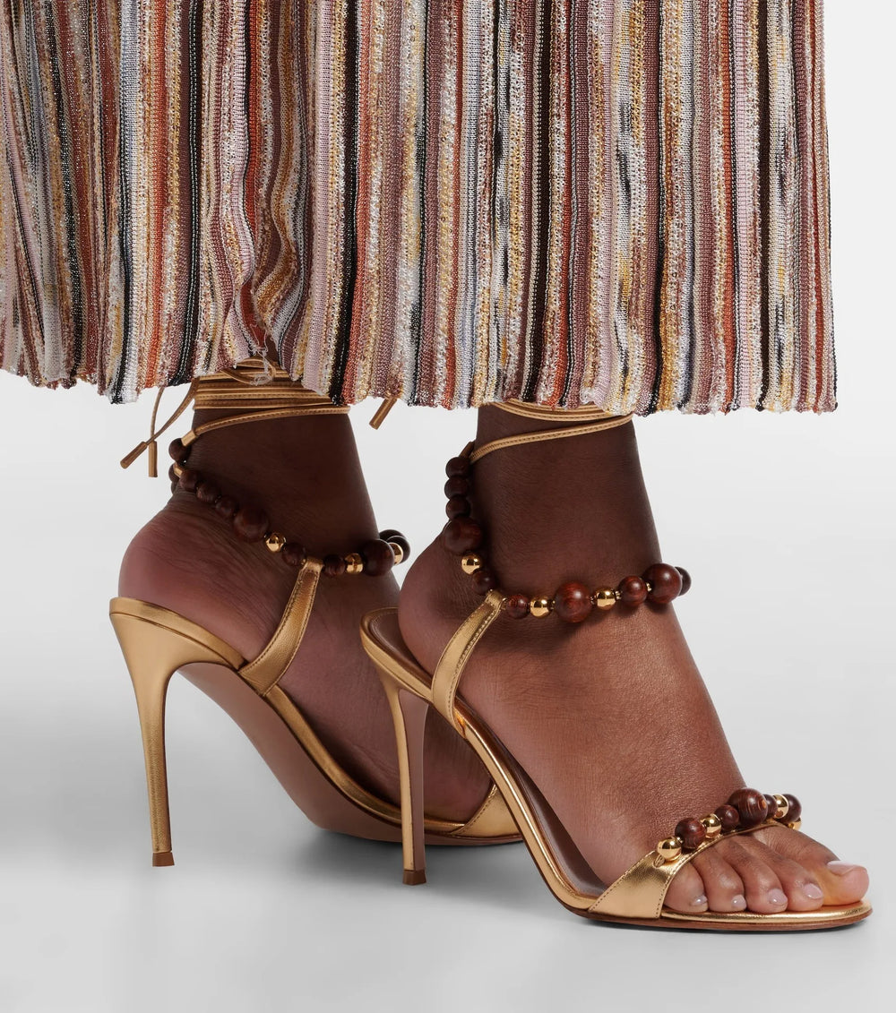 Golden beaded ankle strap stiletto sandals
