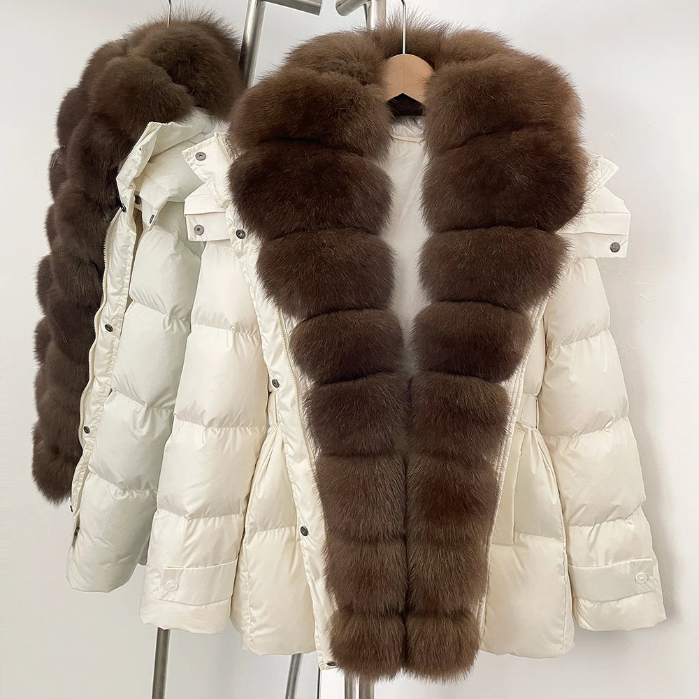 White puffer jacket with brown fur trim on a hanger
